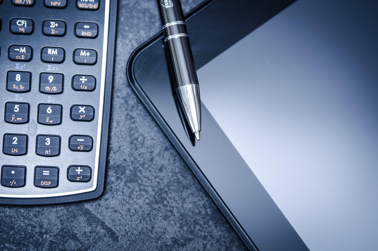 Tablet, calculator, business — Leading with Purpose: Nihar Gala’s Approach to Effective Business Strategy