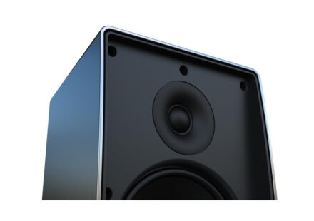 Close-up of a black speaker box with a circular speaker cone